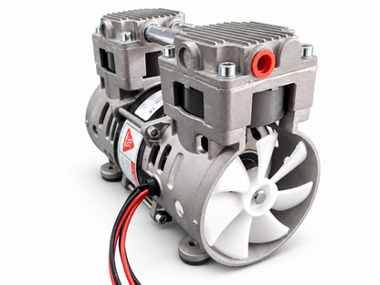 HC250 oil-free piston vacuum pump angled view with ports and cooling fan
